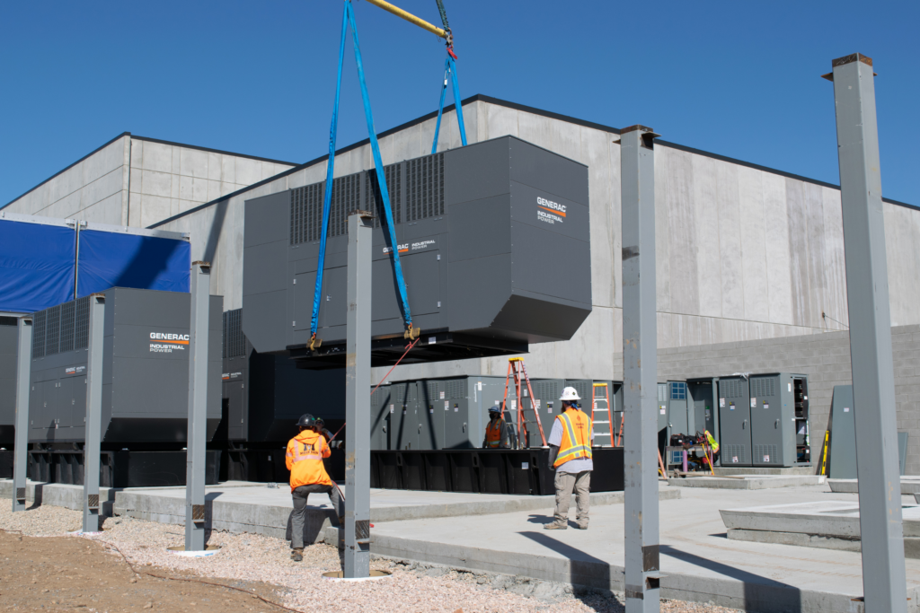 Generator being lifted into place before wall installation